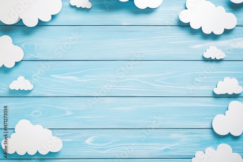 Soft, light blue wooden background with white paper clouds