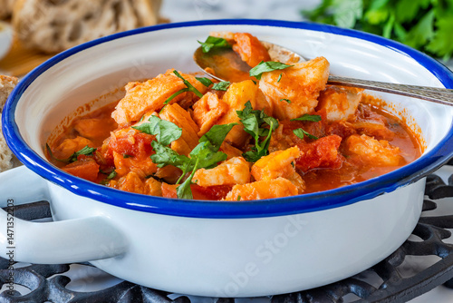 Canvas Print Fish stew made of cod, salmon, smoked haddock and prawns