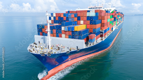 Εκτύπωση καμβά Aerial front view of a large cargo ship fully loaded with colorful shipping containers navigating through calm ocean water