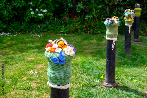 knitted bollard topper with bumblebee butterfly and flowers in titchfield Hampshire England