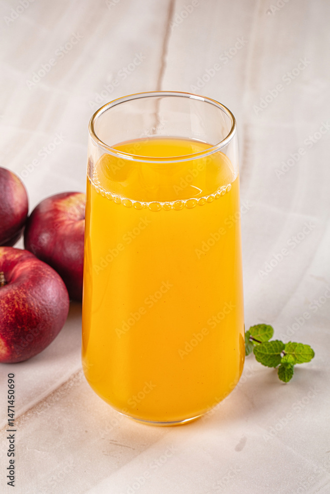 Fototapeta premium Vitamin beverage - peach juice glass