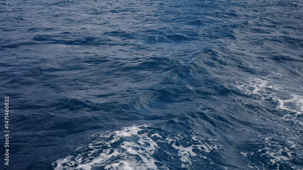 Fototapeta premium Side view from boat in Indian ocean sailing between Seychelles islands in daytime