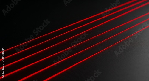 Red laser beams against a black background  