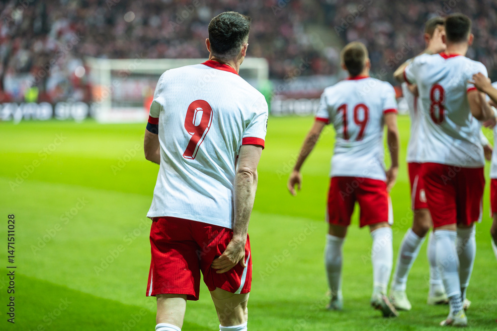 Injured soccer player holding his leg