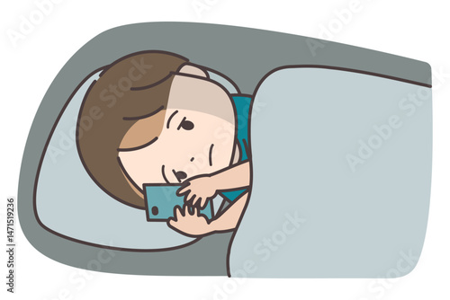 夜中に布団でスマホを見る男の子