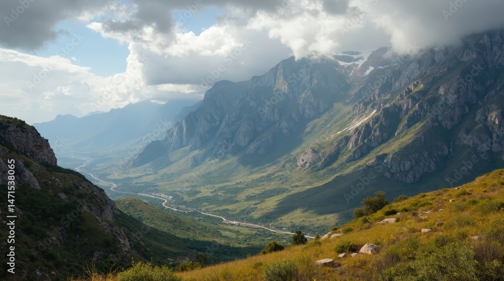 Fototapeta premium Cloudy midday over Sierra de San Pedro, panoramic view of rugged hills and dense woodland.