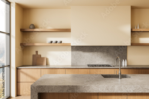 Tablou pe pânză Modern minimalist kitchen interior with wood cabinetry, stone countertops, and neutral tones under natural daylight environment