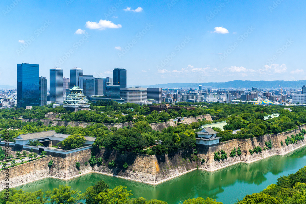 Obraz premium Osaka castle and fortess with clair sky. Osaka castle is Japanese ancient castle is landmark in Osaka,Kansai,Japan,