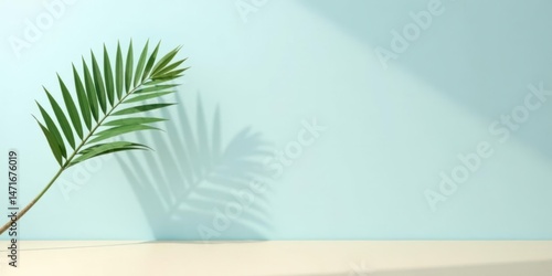 Wallpaper Mural Serene Palm Frond Casts Shadow on Light Blue Background, Minimalist Nature Scene Ideal for Design Inspiration Torontodigital.ca