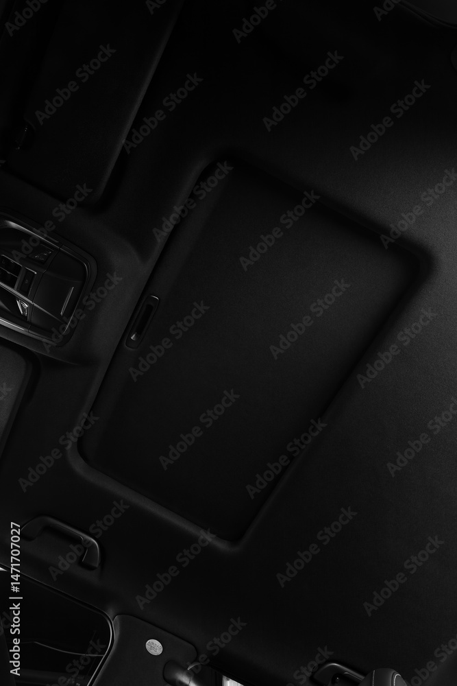 Close-up of the hatch on black roof in luxury interior . Modern car interior Close-up of the hatch on black roof in luxury interior . Modern car interior