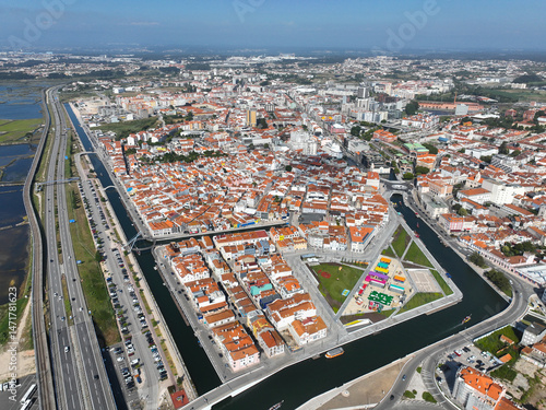 Drone image of Aveiro, Portugal featuring canals, colorful buildings and compact urban design