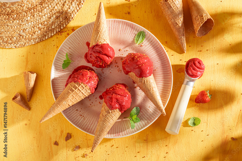 Tasty and homemade strawberry ice cream as a creamy dessert.
