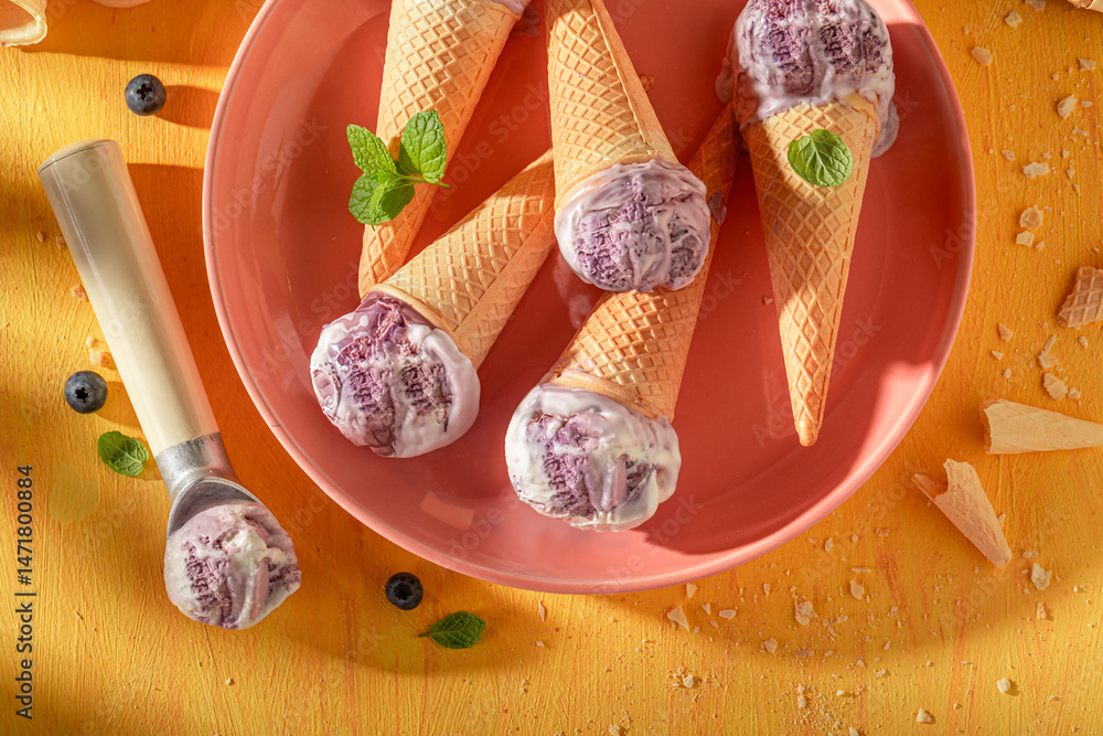 Cold and sweet blueberry ice cream as a creamy dessert.