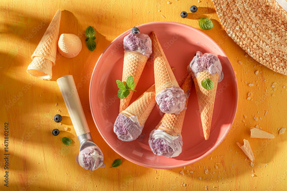 Homemade and tasty blueberry ice cream as a creamy dessert.