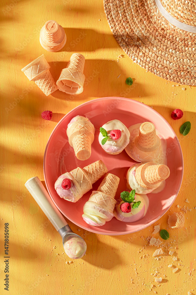 Homemade and cold raspberry ice cream as a summer dessert.