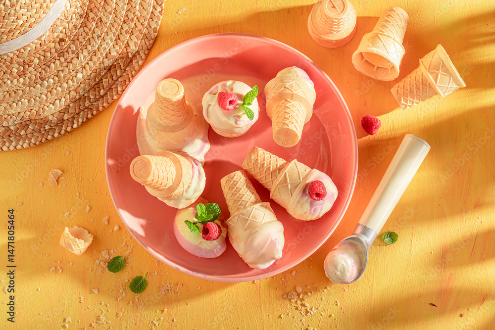Homemade and cold raspberry ice cream as a creamy dessert.