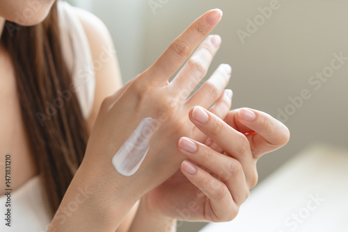 Konstfotografi Health skin care, beauty smile asian young woman, girl  hand applying, putting moisturizer on her arm, shoulder after shower bath at home