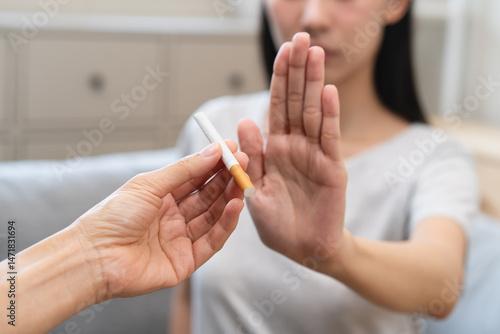 Fotografie addiction asian young woman, girl refusing cigarette, smoker quitting smoke, hand in broken, break tobacco