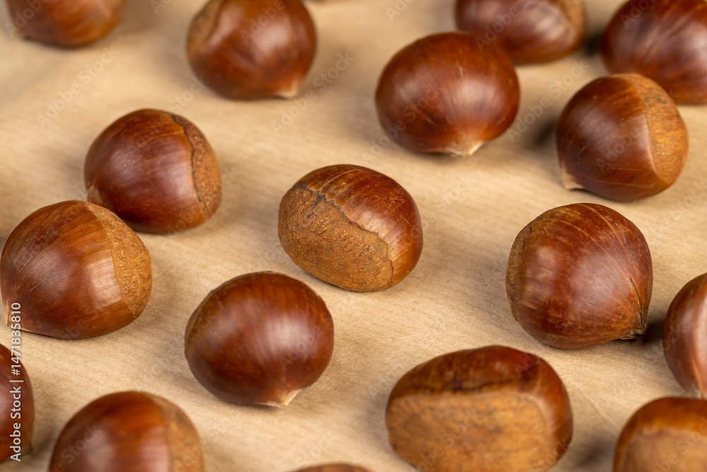 preparation by cutting the shells of edible chestnut nuts for baking, close up preparation by cutting the shells of edible chestnut nuts for baking, close up