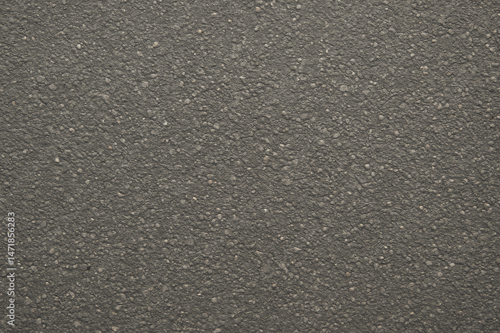 Obraz premium A close-up view of a textured surface showcasing an intricate pattern resembling grains and specks. This versatile image can be used for various design projects and backgrounds.