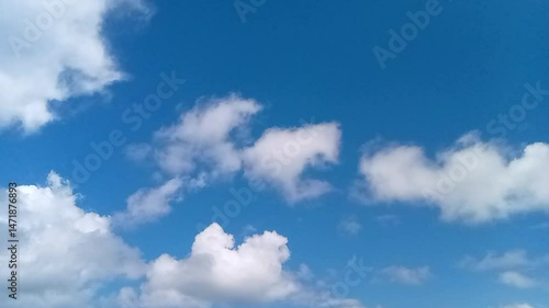 Footage of a bright sky with beautiful white clouds.