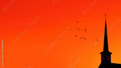 Silhouetted church steeple against a vibrant sunset with birds flying in the background