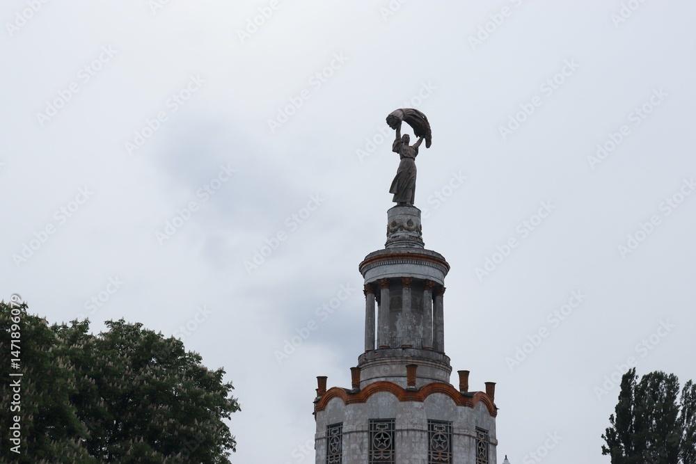 Fototapeta premium Figure of a woman with a sheaf of ears, exhibition center, Kyiv, Ukraine