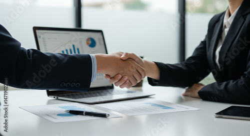 Business Deal: Handshake, Data Analysis, and Collaboration - Success, Partnership, and Growth in Office Setting.