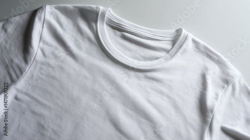White T-shirt with Prominent Central Stain on Plain Beige Background, Minimalist Apparel Display Concept.