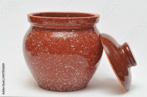brown ceramic pot with lid on white background