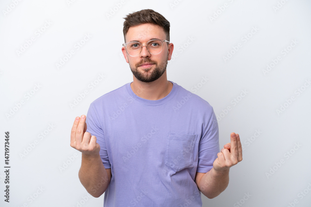 Fototapeta premium Young caucasian man isolated on white background making money gesture