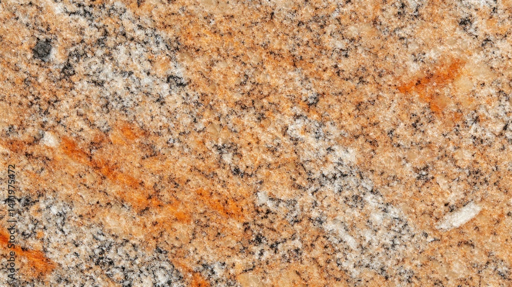 Textured granite surface with orange and grey veining Textured granite surface with orange and grey veining