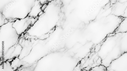 Detailed close-up of Carrara marble with faint grey veins.