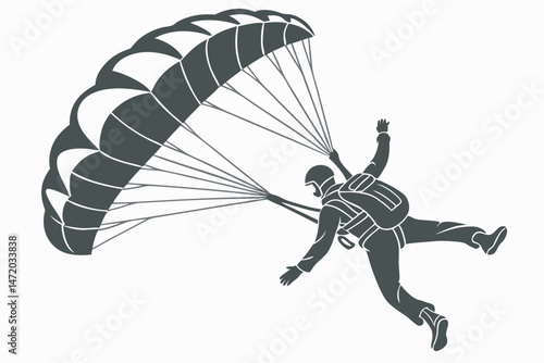 Isolated silhouette of a skydiver with parachute in action ready to land
