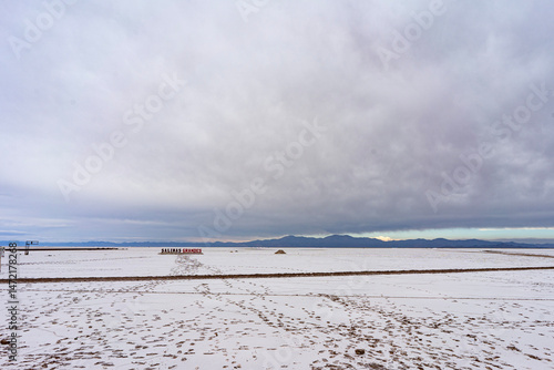 Salinas Grandes, Jujuy, Argentina - 22.04.2025: View of the Salinas Grandes sign with mountains in the background.