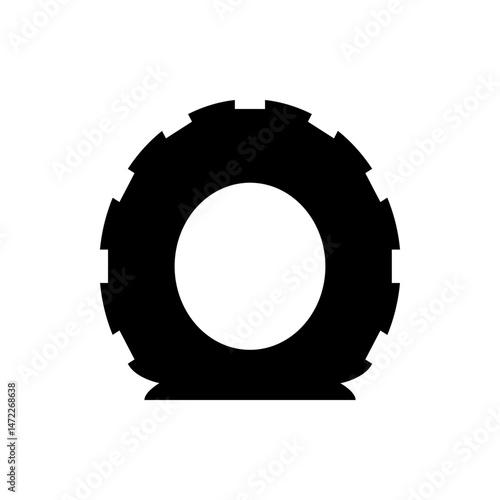 Illustration of a black tractor tire with a tread pattern and a white center on a white background image