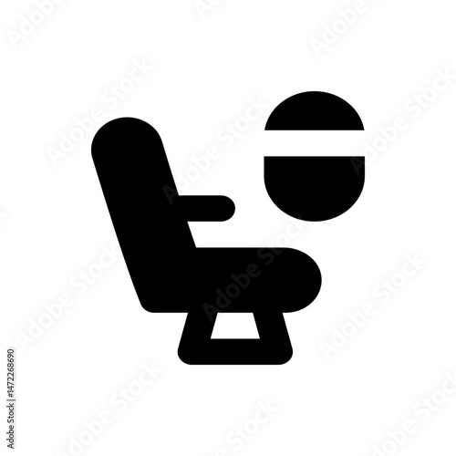 A black silhouette of a chair with armrests and a headrest and a round object with a line above it