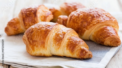 Wallpaper Mural Golden-brown croissants arranged on a linen napkin, showcasing their flaky layers and rich buttery texture, perfect for a breakfast or brunch setting. : Generative AI Torontodigital.ca