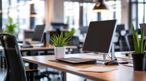 Wallpaper Mural Modern office workspace with a computer, keyboard, and mouse on a light wood desk, featuring plants and blurred background of other workstations. : Generative AI Torontodigital.ca