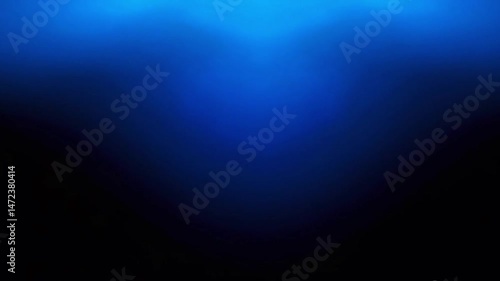 One Blue Top Spot Bright Light illuminating a studio stage on a black background