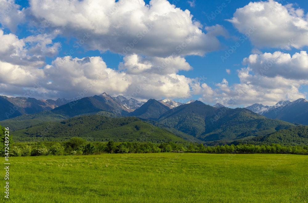 Fototapeta premium Landscape with the Fagaras Mountains in Romania seen from a distance