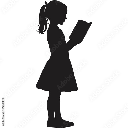 Silhouette of little girl reading a book in a dress.