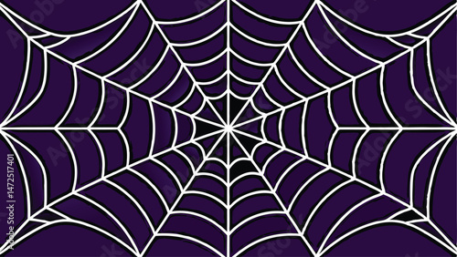 A white spiderweb is centered on a dark purple background.