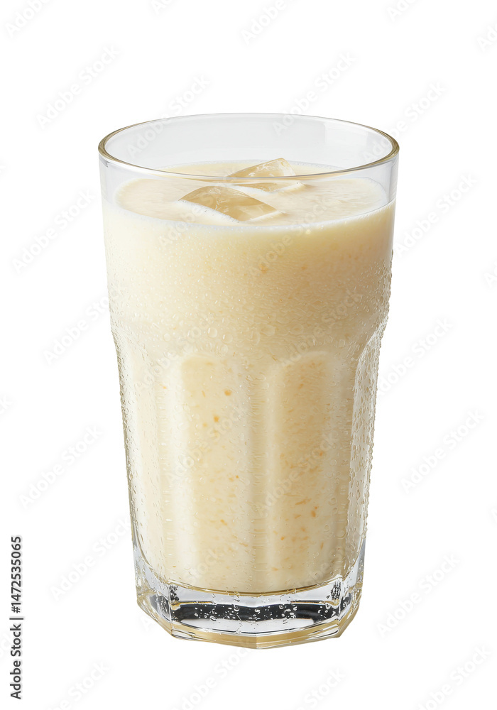 Glass filled with creamy, orange drink with visible ice cubes. Refreshing beverage Glass filled with creamy, orange drink with visible ice cubes. Refreshing beverage