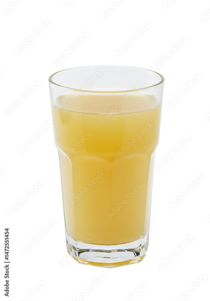A glass is filled with bright yellow liquid, set on a dark background A glass is filled with bright yellow liquid, set on a dark background