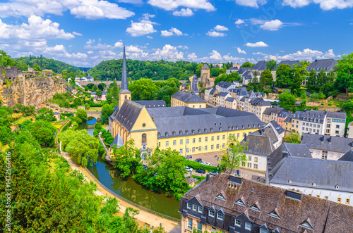 Luxembourg City historical centre aerial view with Neimënster Abbey, Saint John's on the Stone catholic Church, Rham Plateau, Bock Casemates fortification above river Alzette valley in Grund district