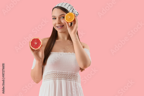 Young woman with orange and...