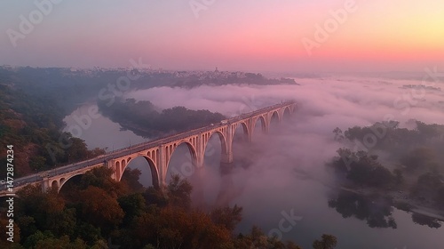 Wallpaper Mural   An aerial view of a bridge over a river in a foggy forest with a sunset in the background Torontodigital.ca