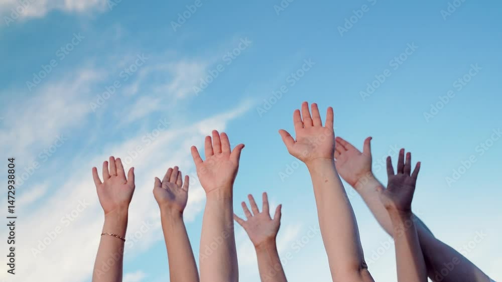 Hands are raised sequentially collective hand gestures teamwork. Individuals raise hands toward blue sky as sign of unity. Business collective decision making of people. People put hands up one by one Hands are raised sequentially collective hand gestures teamwork. Individuals raise hands toward blue sky as sign of unity. Business collective decision making of people. People put hands up one by one