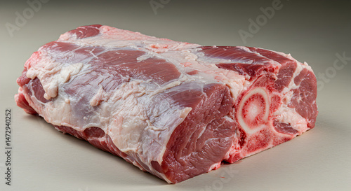 Raw Pork Shoulder Roast Displaying Marbling and Bone Structure for Culinary Purposes